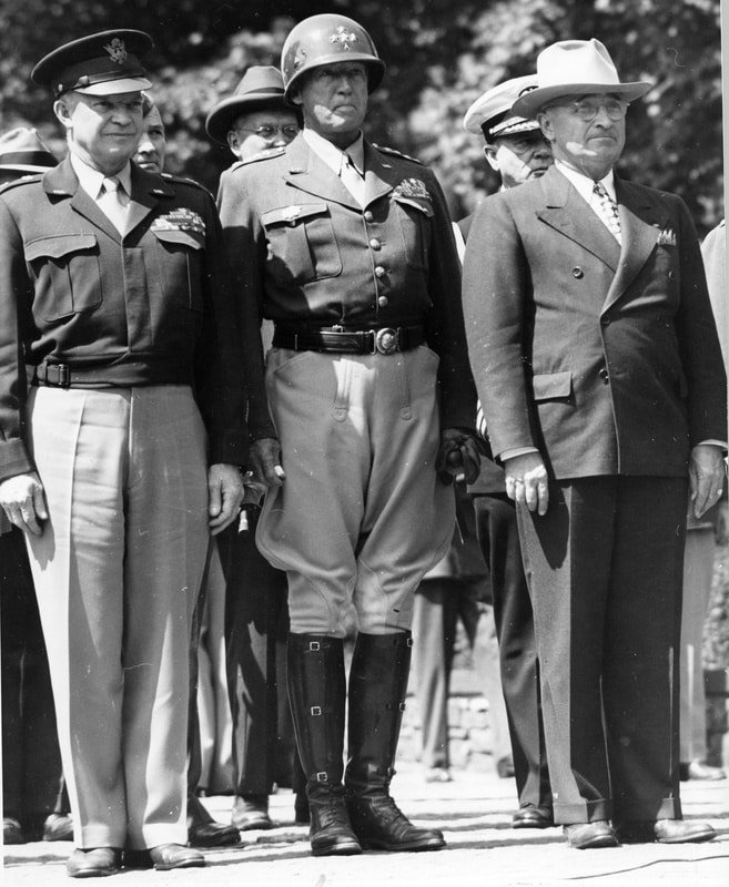 General Dwight Eisenhower, General George Patton, and President Harry S. Truman. The Flag of Liberation is being raised over the former Nazi headquarters in Berlin