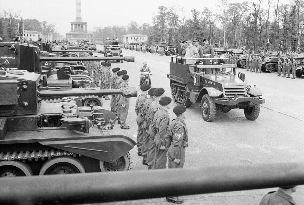 Winston Churchill, accompanied by Field Marshal Sir Bernard Montgomery and Field Marshal Sir Alan Brooke, inspects tanks of 7th Armoured Division