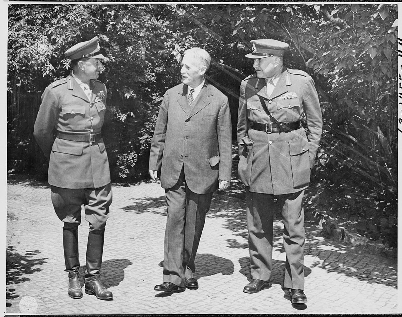 US Secretary of War Henry Stimson chatting with British Field Marshals Alexander and Maitland Wilson