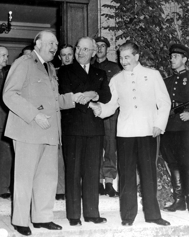 The 'Triple Handshake' - Truman, Stalin, and Churchill share a lighthearted moment