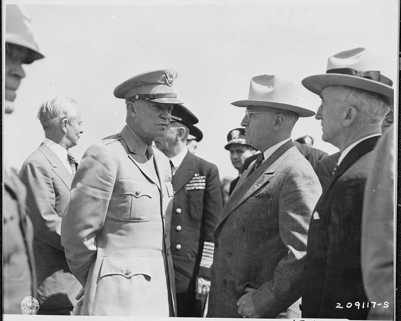Eisenhower chats with Truman at an airfield in Brussels, Belgium where the President is waiting to fly to Berlin