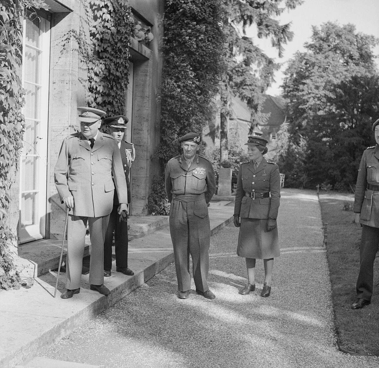 3-power Meeting at Potsdam. Mr Churchill with Commander Thompson, Field Marshal Montgomery and Junior Commander Mary Churchill on his arrival for the Conference.