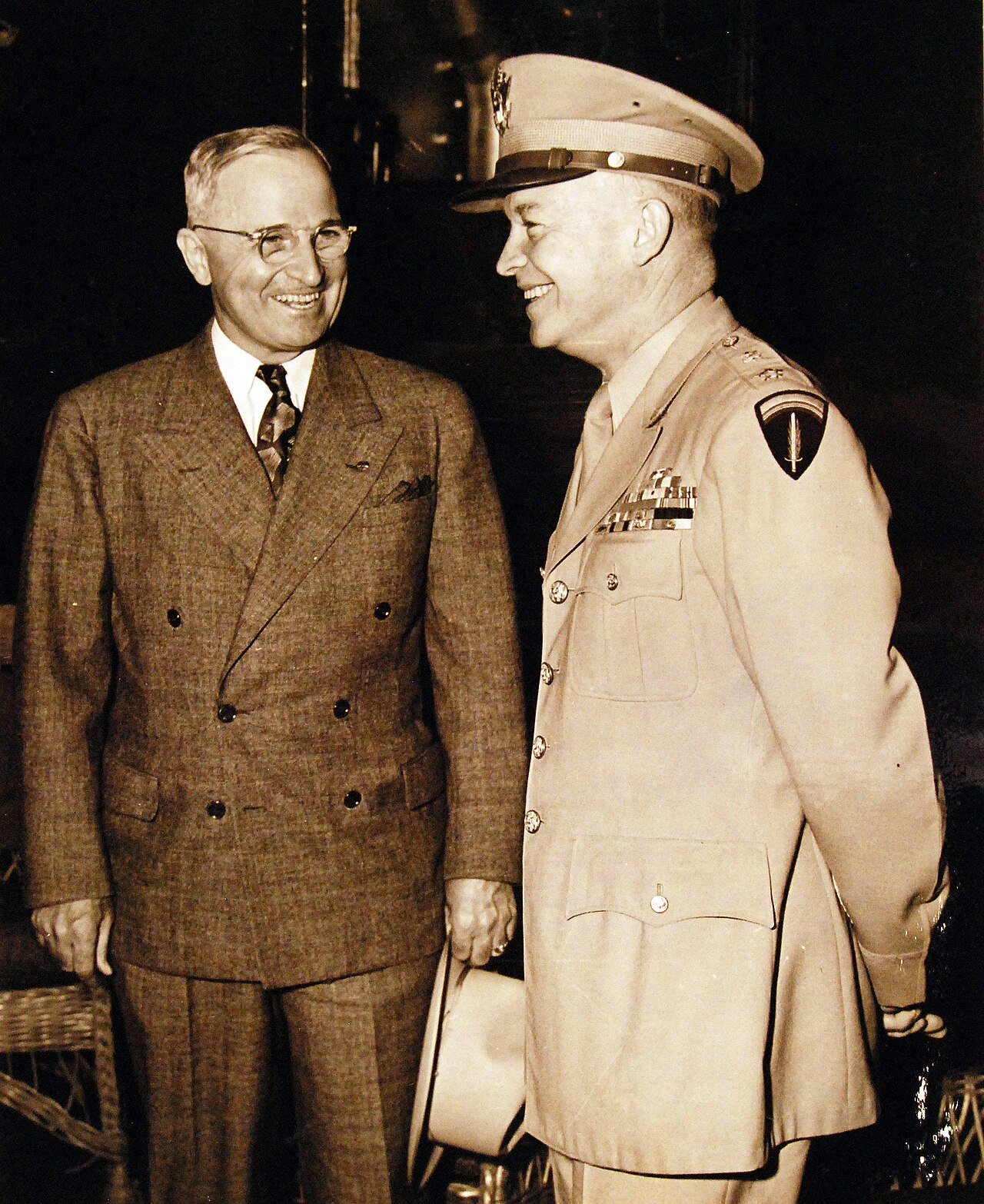 80-G-49922: Potsdam Conference, 17 July – 2 August 1945. President Harry S. Truman being greeted by General Dwight D. Eisenhower onboard USS Augusta (CA 31) as he arrived in Antwerp. Photograph received July 18, 1945. U.S. Navy Photograph, now in the collections of the National Archives. (2016/02/23).