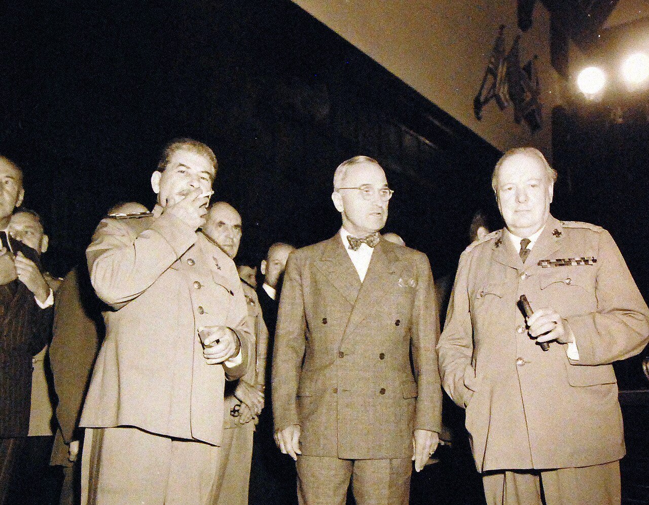 80-G-49961: Potsdam Conference, 17 July – 2 August 1945. The “Big Three” in conference room at Potsdam, Germany, just before start of the first session. Shown: Premier Joseph Stalin, President Harry S. Truman, and Prime Minister Winston Churchill. Photograph received July 18, 1945. U.S. Navy Photograph, now in the collections of the National Archives. (2016/02/23).