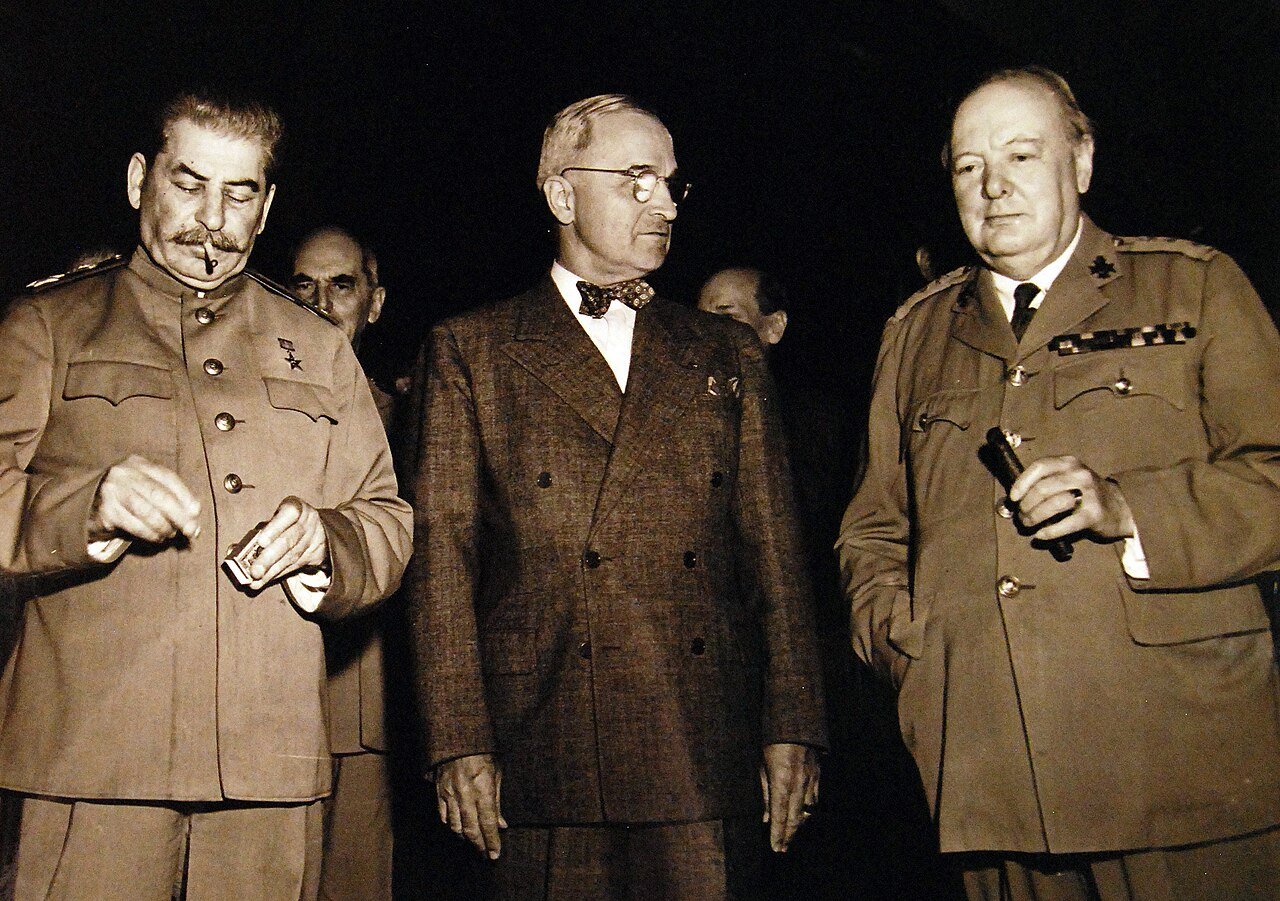 80-G-49986: Potsdam Conference, 17 July – 2 August 1945. A moment before the start of the first session of the conference. The “Big Three” chat informally in Berlin, Germany. Shown, (left to right), Premier Joseph Stalin, President Harry S. Truman, and Prime Minister Winston S. Churchill. Photograph received July 24, 1945. U.S. Navy Photograph, now in the collections of the National Archives. (2016/02/23).