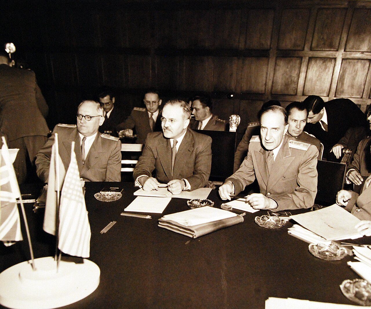 80-G-700118: Potsdam Conference, 17 July – 2 August 1945. The “Little Three” (Foreign Ministers) meeting in the same conference room as the Heads of States at Potsdam, Germany. Foreign Commissar V. Molotov in the center. Photographed released July 24, 1945. U.S. Navy Photograph, now in the collections of the National Archives. (2016/02/23).