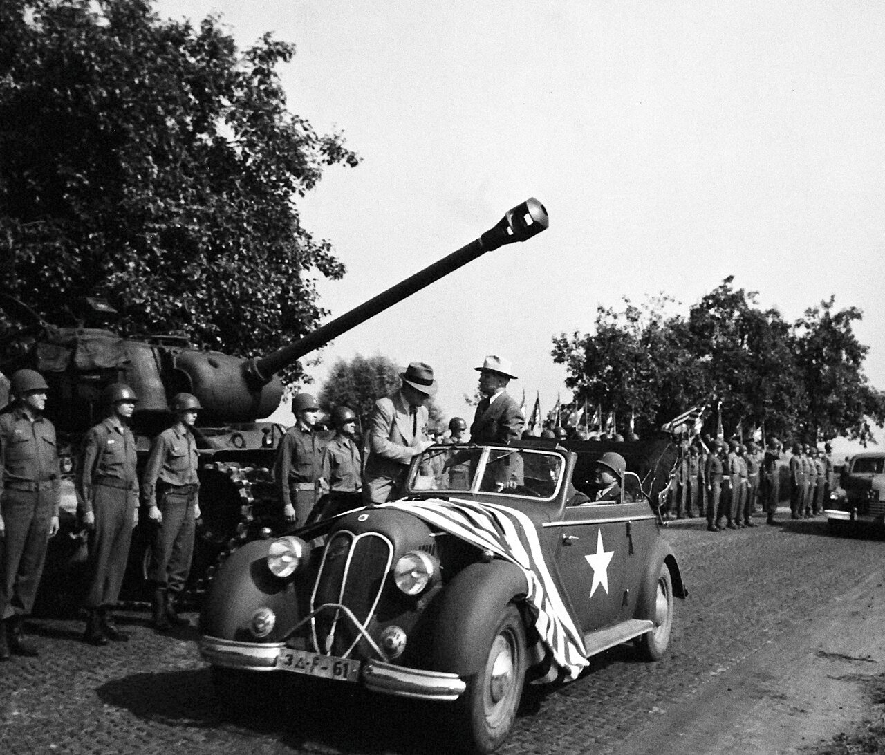 80-G-700170: Potsdam Conference, 17 July – 2 August 1945. President Harry S. Truman and party inspecting troops of 3rd Armored Division just south of Frankfurt, Germany. Photographed by CPhoM William Belknap Jr., released July 26, 1945. U.S. Navy Photograph, now in the collections of the National Archives. (2016/02/23).
