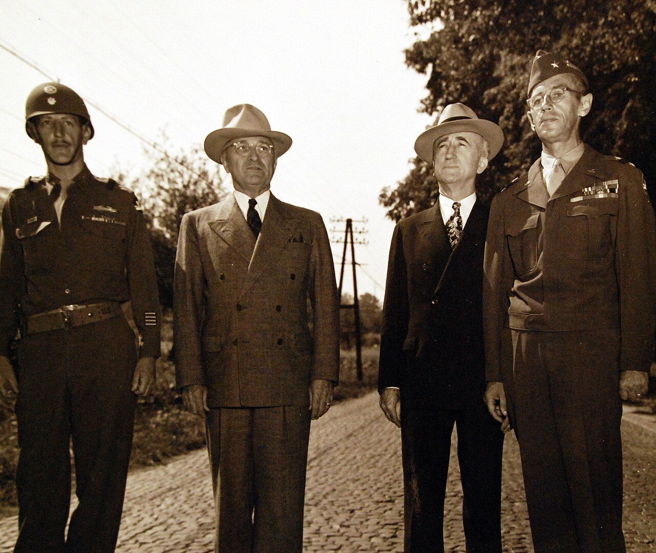 80-G-700174: Potsdam Conference, 17 July – 2 August 1945. President Harry S. Truman and party while inspection tour of troops in Germany visits the 84th Division at Heppenheim, Germany. Left to right: Colonel R. Tucker, Commander, 3rd Battalion, the President, Secretary of State James F. Byrnes and Major General Alexander R. Bolling, Commander of 84th Division. Photographed by CPhoM William Belknap Jr., released July 26, 1945. U.S. Navy Photograph, now in the collections of the National Archives. (2016/02/23).