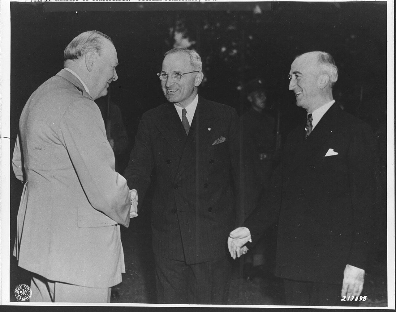 Scope and content: Prime Minister Winston Spencer Churchill of Great Britain greets two of his dinner guests in the garden in front of his conference area residence in Berlin, Germany. Prime Minister Churchill, President Harry S. Truman and Secretary of State James F. Byrnes. 07/23/45.