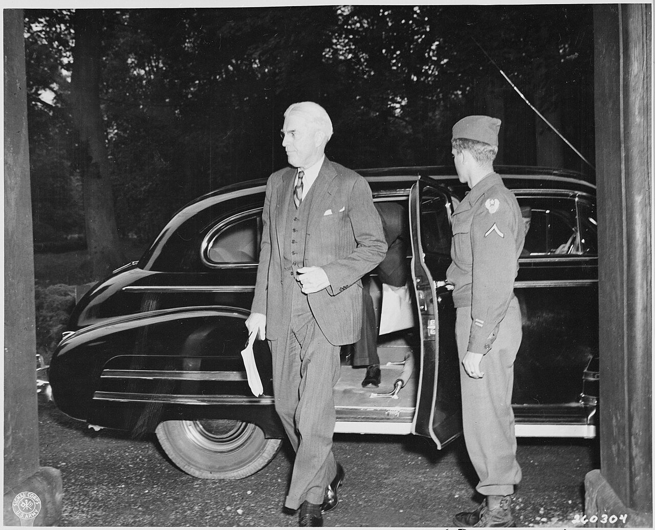Assistant Secretary of State Will Clayton arrives by limousine for the Potsdam Conference in Germany.