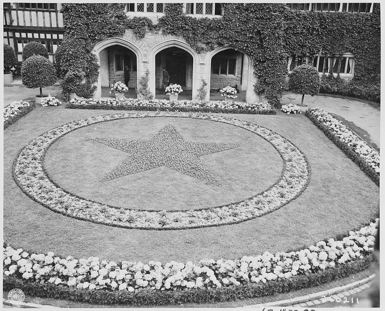 At Cecilienhof Palace, site of the Potsdam Conference in Potsdam, Germany, the delegates approach the main entrance…