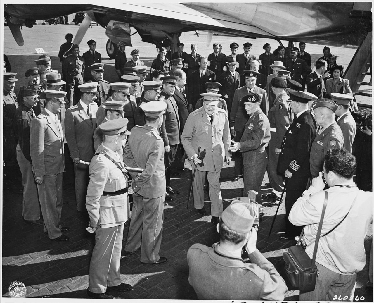 British Prime Minister Winston Churchill is greeted by Field Marshall Bernard Montgomery at Gatow Airport in Berlin…