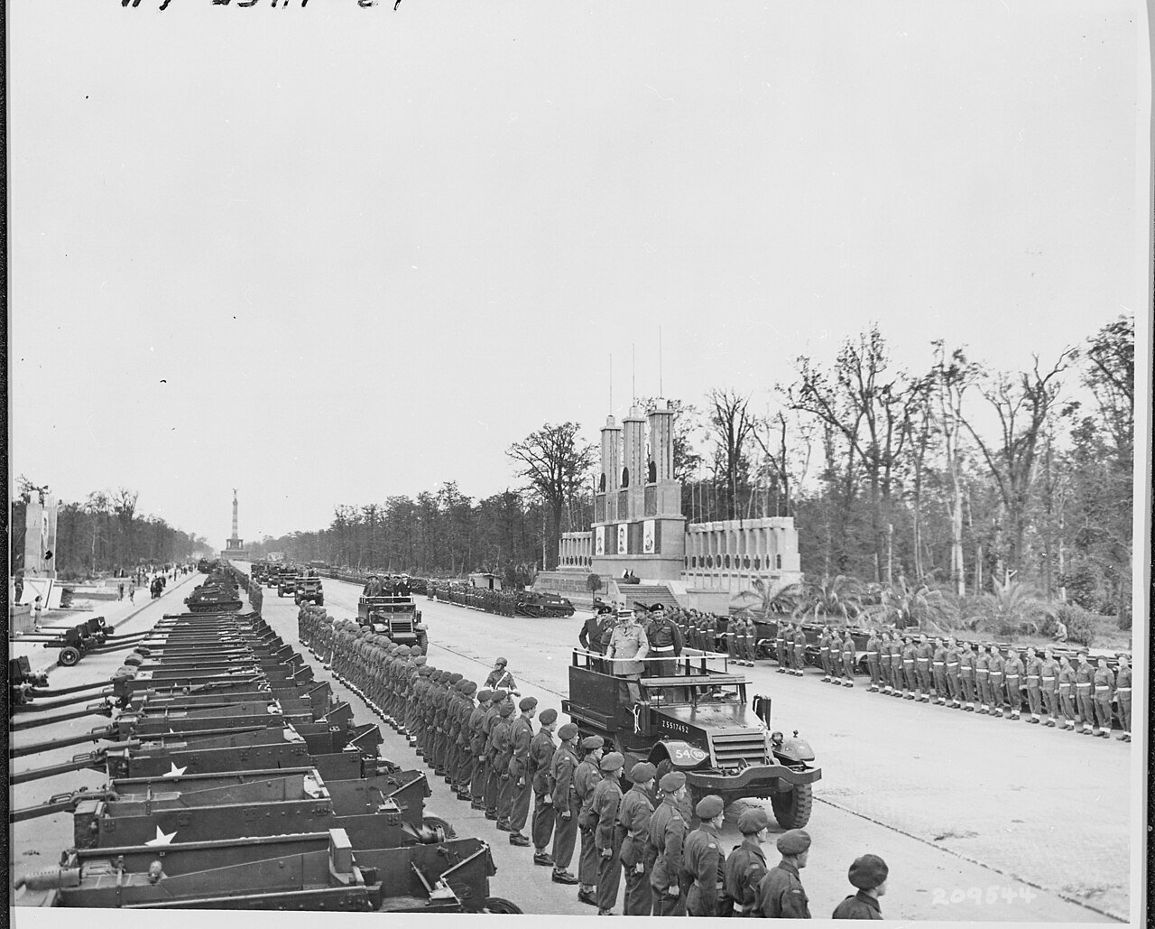 British Prime Minister Winston Churchill passes the parade of Bren carriers belonging to the Canadian contingent…
