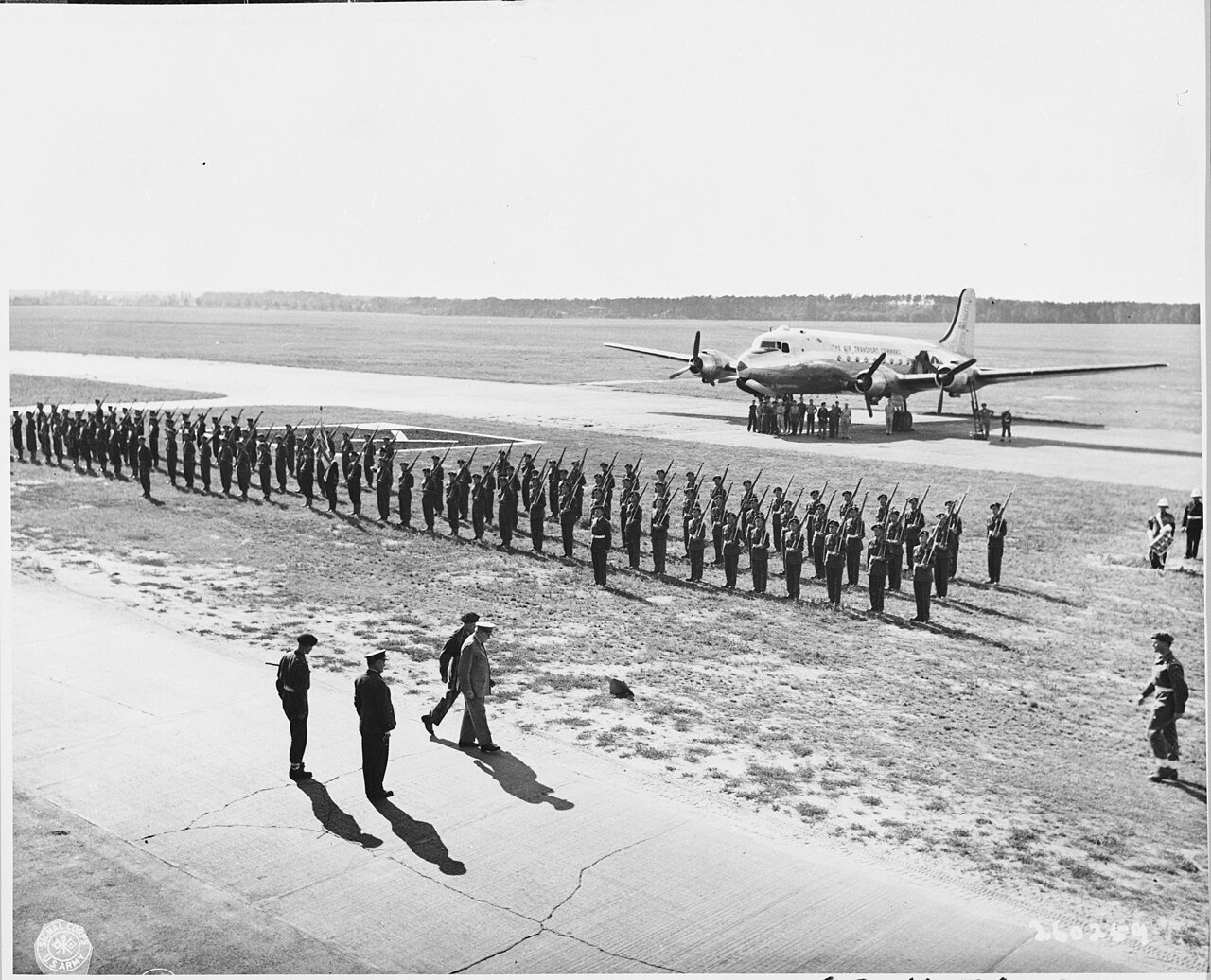 British Prime Minister Winston Churchill reviews an honor guard of the Royal Navy, Canadians, Royal Air Force, and a…