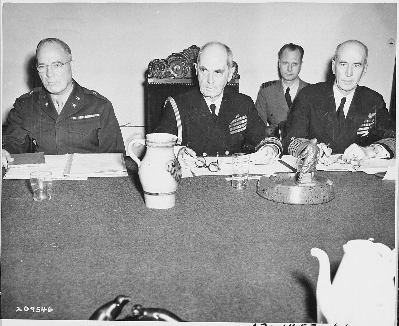 Chiefs of Staff Brig. Gen. A. J. McFarland, Adm. William Leahy, and Adm. Ernest J. King at a meeting during the…