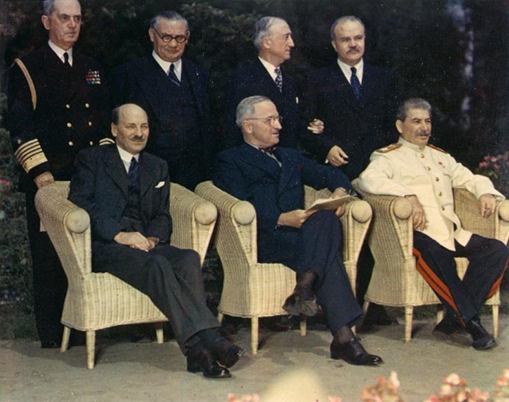 Clement Attlee , Harry S. Truman , and Joseph Stalin at the Potsdam Conference , July 1945. The "Big Three" pose with their principal advisors, at Potsdam, Germany, circa 28 July -- 1 August 1945. The three heads of government are (seated, left to right): British Prime Minister Clement Attlee; U.S. President Harry S. Truman; Soviet Premier Joseph Stalin. Standing behind them are (left to right): Fleet Admiral William D. Leahy , USN, Truman's Chief of Staff; British Foreign Minister Ernest Bevin; U.S. Secretary of State James F. Byrnes; Soviet Foreign Minister Vyacheslav Molotov.