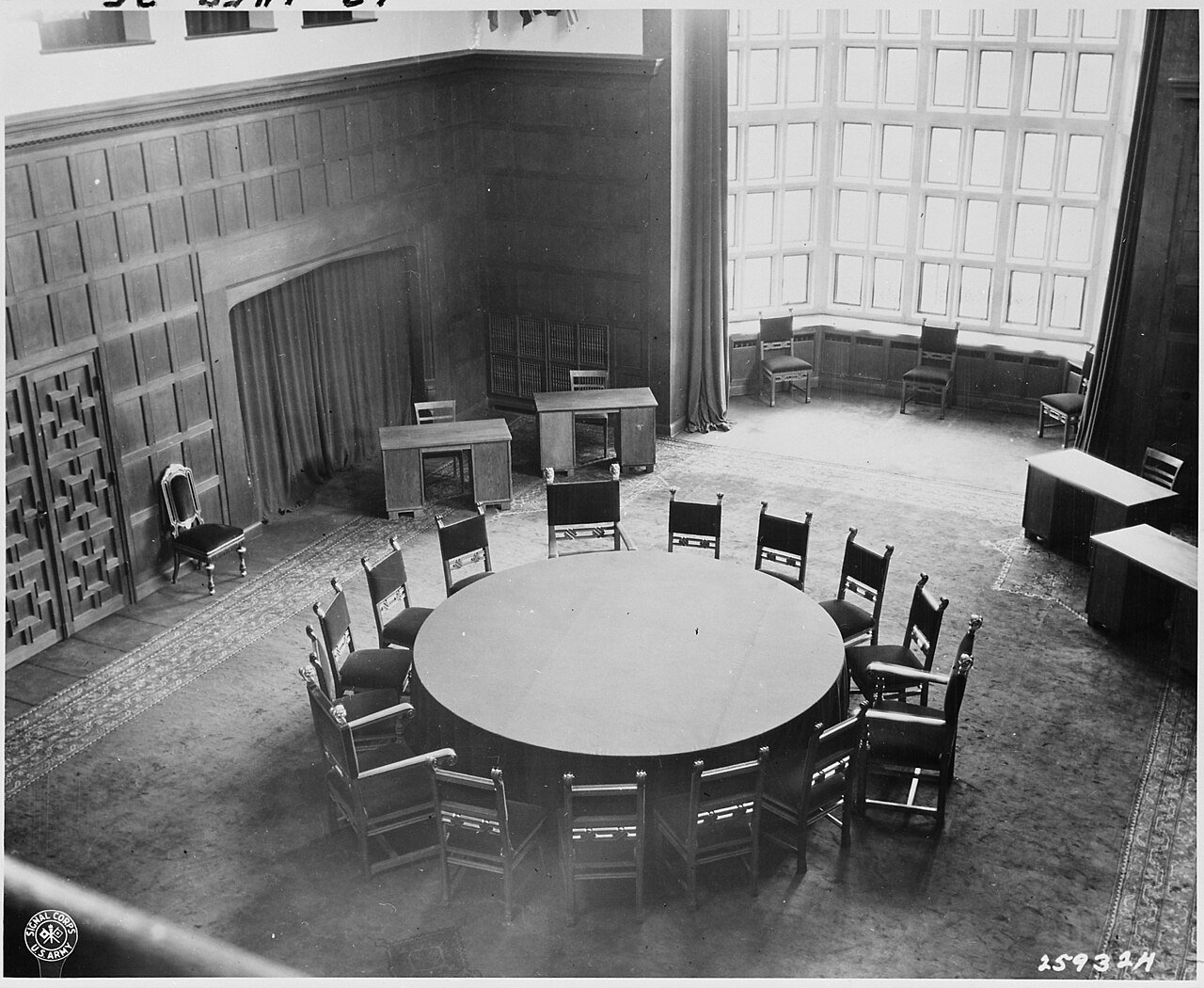 Conference table at Cecilienhof Palace, site of the Potsdam Conference in Potsdam, Germany. The table is covered with…