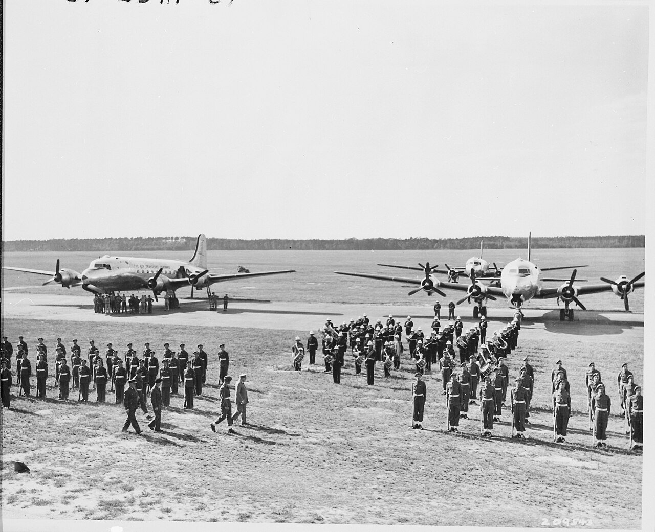 Distance view of British Prime Minister Winston Churchill inspecting the honor guard at Gatow Airport in Berlin…