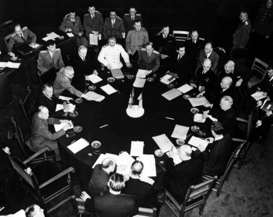 General view of the conference table at the Potsdam Conference.Josef Stalin can be seen at the center of the table in the white uniform. Others from his left are: unidentified Soviet military official; Andre Gromyko; Admiral William Leahy; Secretary of State James Byrnes; President Harry S. Truman; Charles Bohlen; Joseph E. Davies; Sir Alexander Cadogan; Clement R. Attlee; Major Birse of Britain; unidentified Soviet official; Andre I. Vishinsky, Soviet Vice Commissar for Foreign Affairs; Soviet Foreign Minister Vyashaslav Molotov. The Soviet official between Vishinsky and Molotov is A. B. Podtserob. Directly behind Molotov is Mr. Tsarapkin, Mr. Novikov, Mr. Arutyunyan and unidentified Soviet official. On the far right, holding papers in his lap, is Averell Harriman.