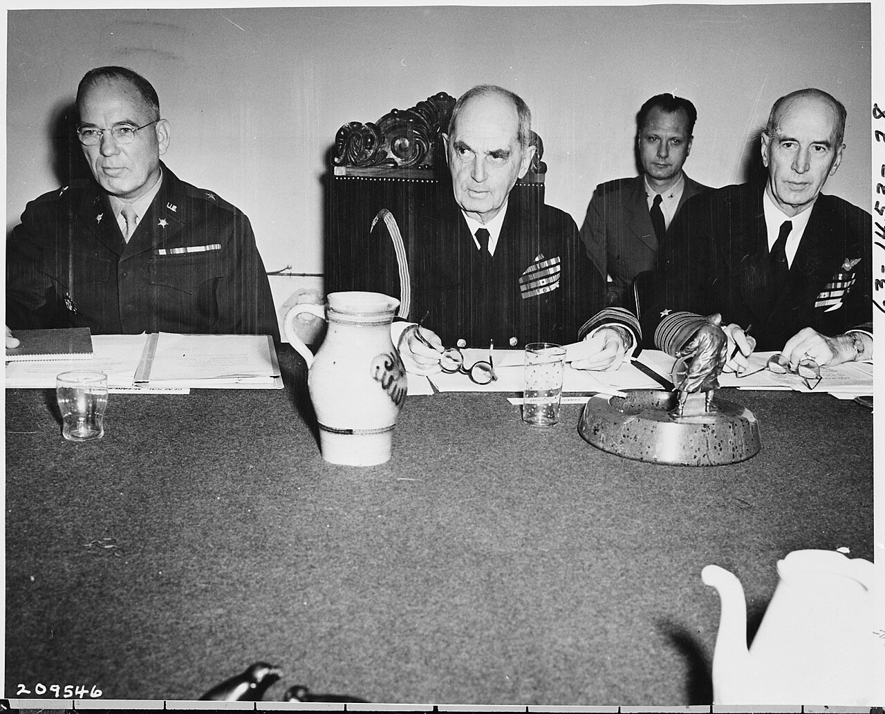 L to R, Brig. Gen. Andrew J. McFarland, Fleet Admiral William Leahy, and Fleet Admiral Ernest King at a conference…
