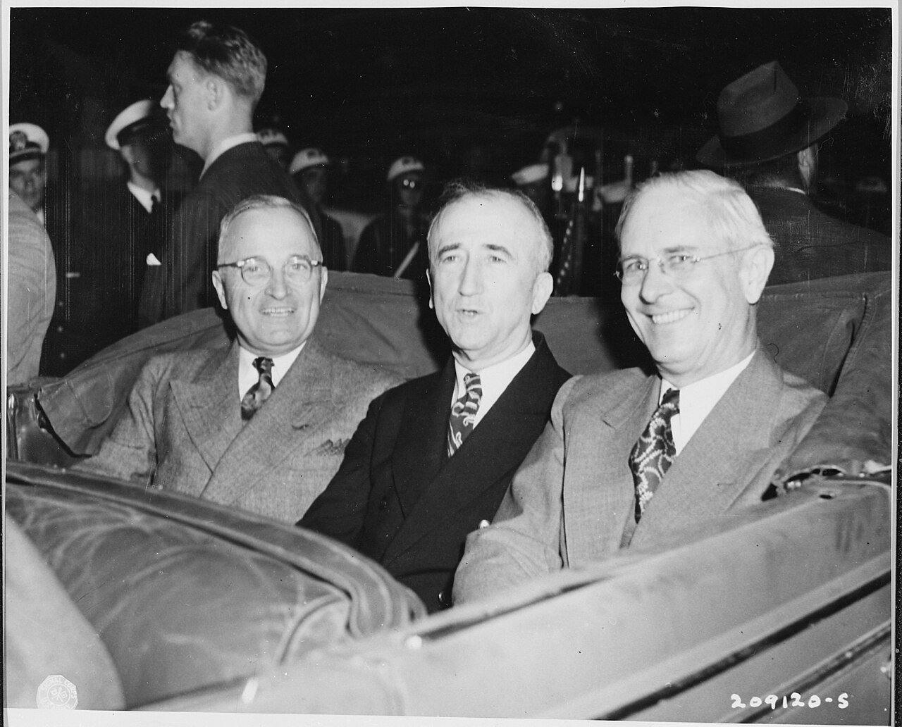 L to R, President Harry S. Truman, Secretary of State James Byrnes, and Ambassador to Belgium Charles Sawyer seated…