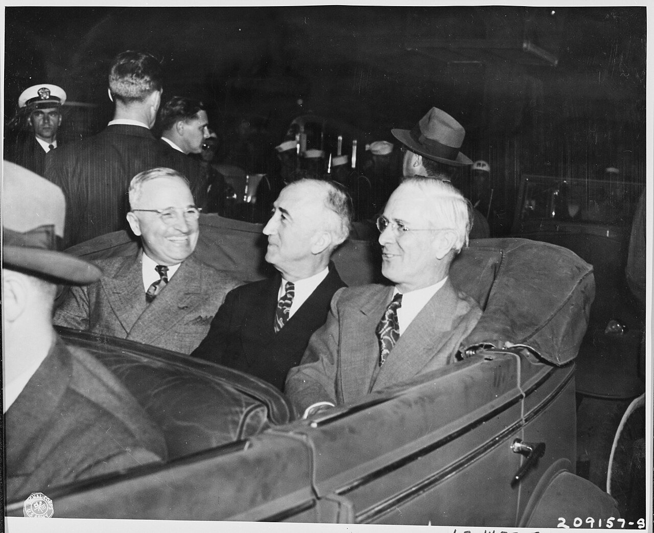 L to R, President Harry S. Truman, Secretary of State James Byrnes, and Ambassador to Belgium Charles Sawyer in a car…