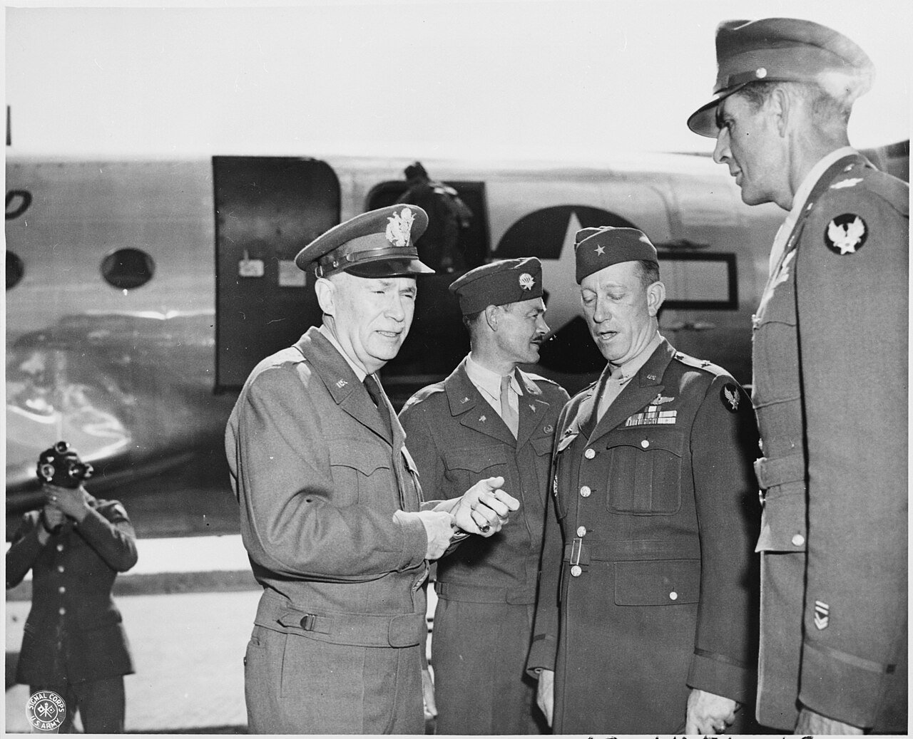 Lt. Gen. Brehon Somervall, left, is greeted by Brig. Gen. Earl Hoag, third from the left, Commanding General of the…