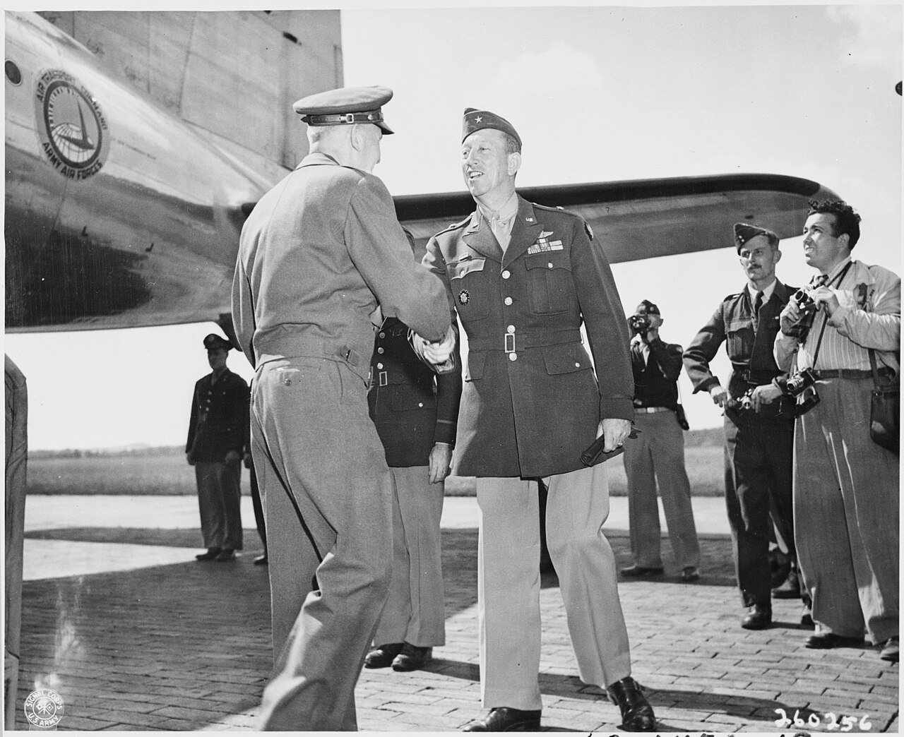 Lt. Gen. Brehon Somervell, left, shakes hands with Brig. Gen. Earl Hoag, right, Commanding General of the Air…