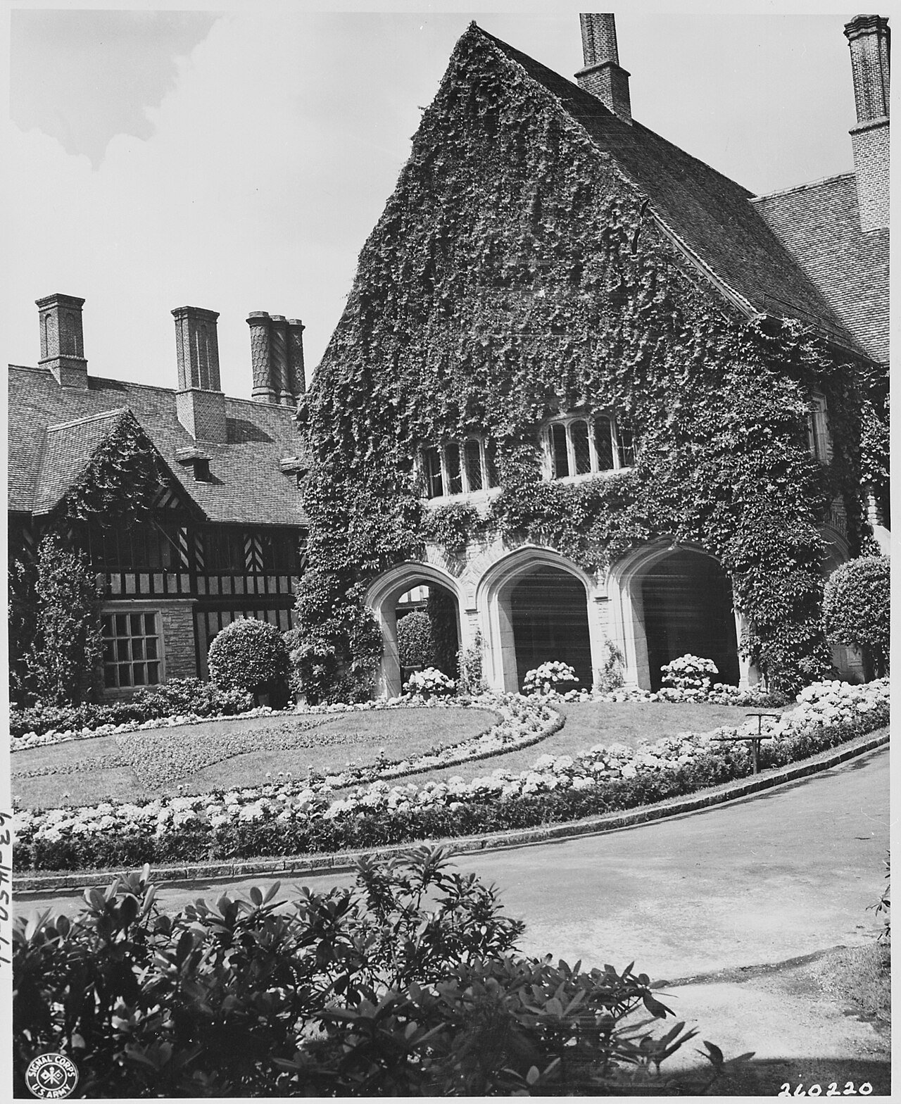 Main entrance to Cecilienhof Palace in Potsdam, Germany, site of the Potsdam Conference. In center of this bed of…
