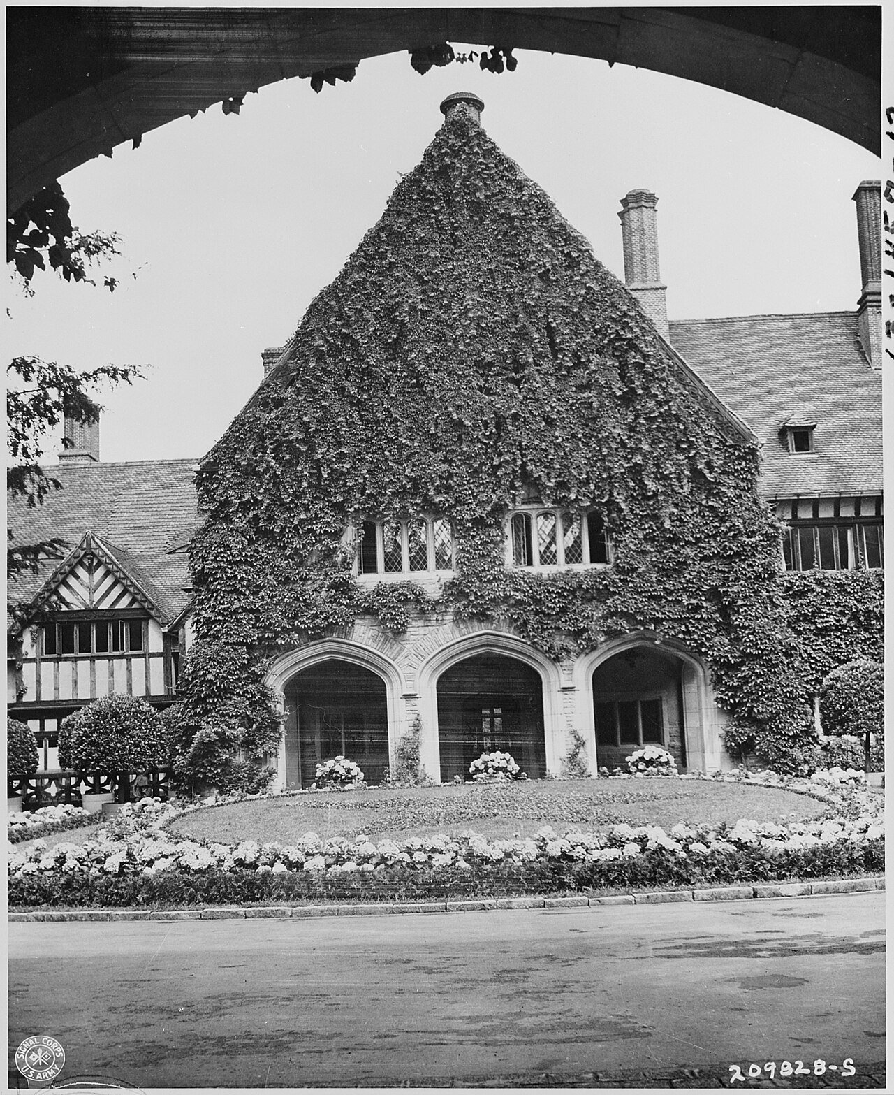 Main entrance to the Cecilienhof Palace, Potsdam, Germany, site of the Potsdam Conference. The circular driveway…