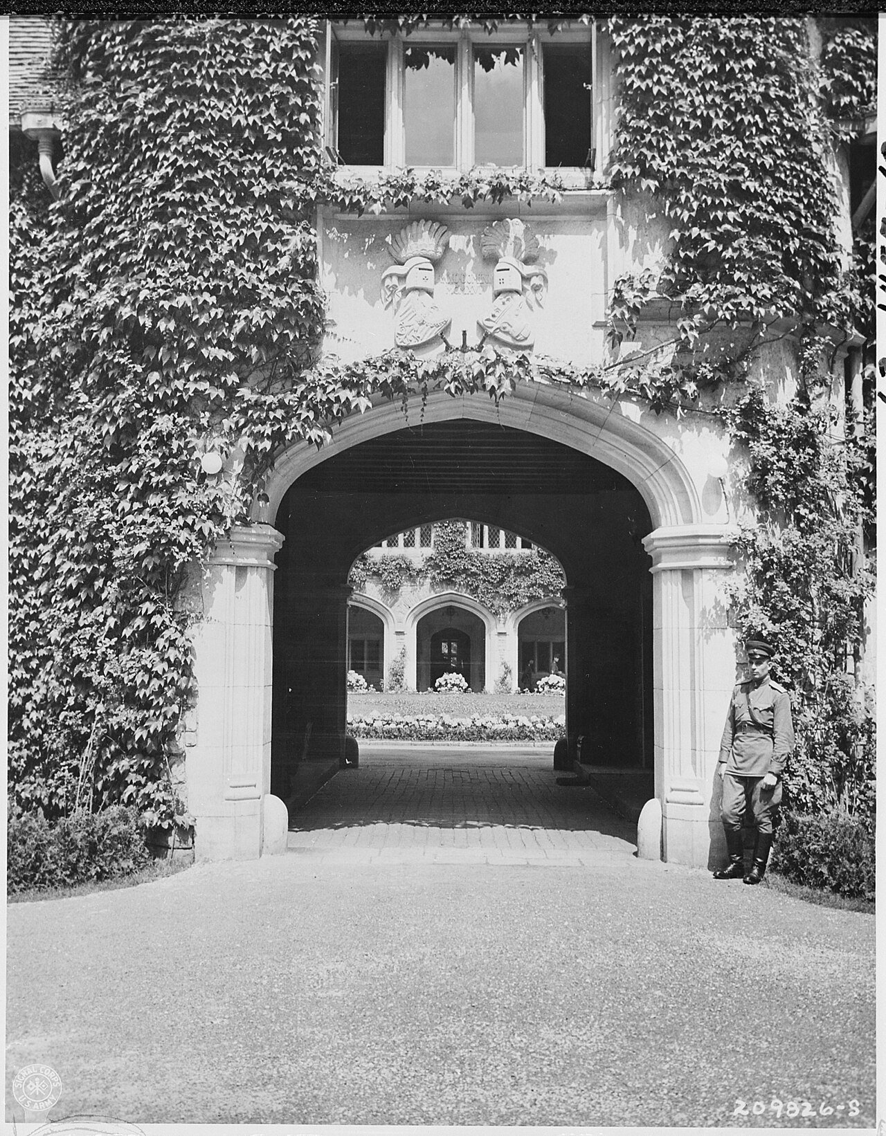 Main entrance, within grounds, to the Cecilienhof Palace, Potsdam, Germany, scene of the Potsdam Conference. It is…