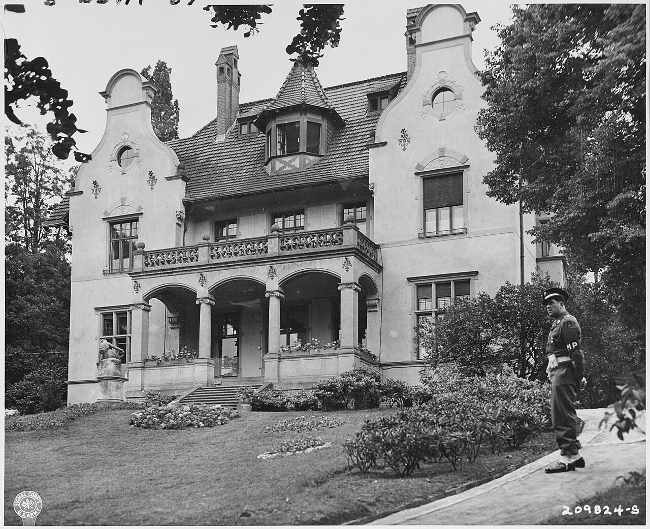 Military Police stand guard in front of the "Little White House," residence of President Harry S. Truman in…