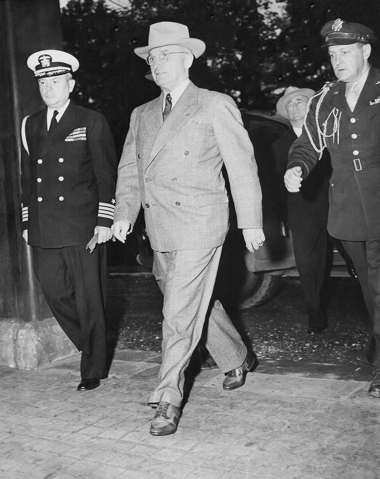 Naval Aide Captain James K. Vardaman (left) and President Harry S. Truman arrive at the Potsdam Conference area.…