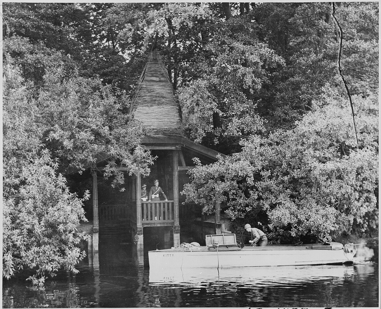Patrol boat keeps guard on Griebnitz Lake fronting the "Little White House," residence of President Harry S. Truman…