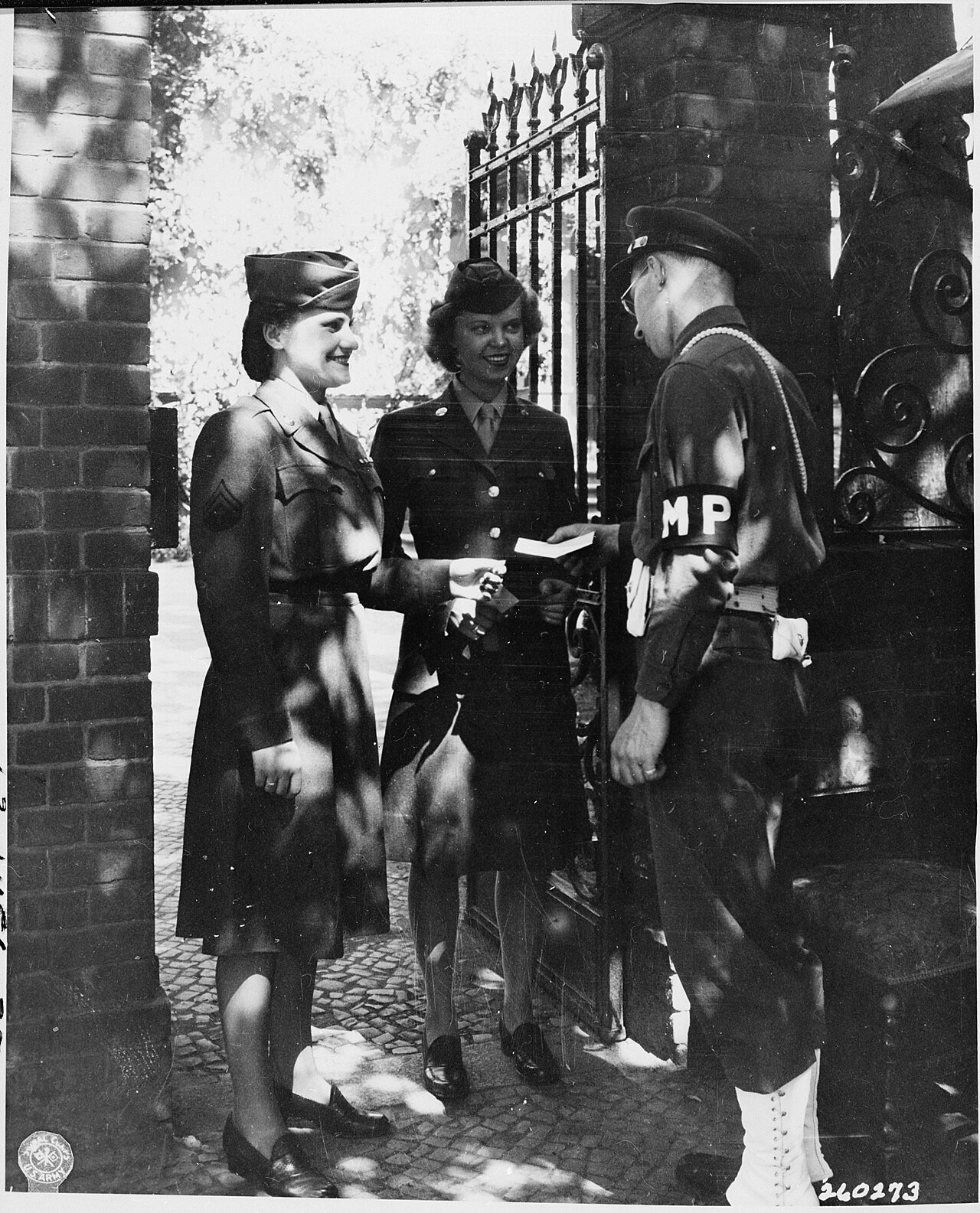 PFC William Gleason of Somerville, Massachusetts, Military Policeman on duty at the gate entrance to the "Little…