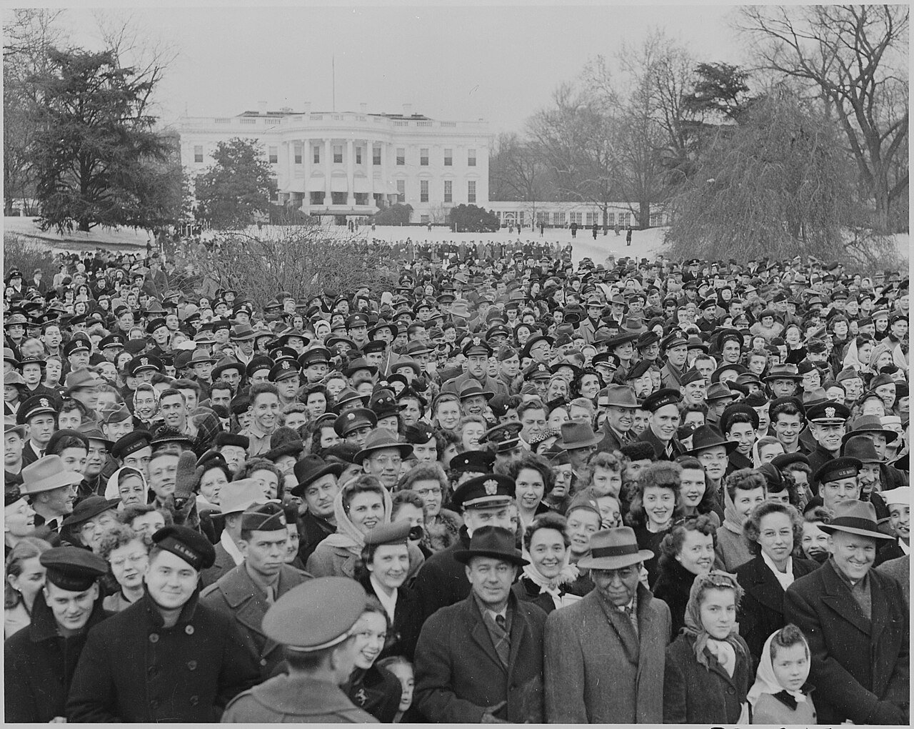 Photograph of a large crowd assembled on the South Lawn of the White House for the lighting of the National Community…