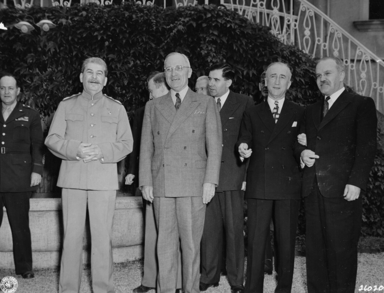 Stalin, Truman, Gromyko, Byrnes and Molotov at Potsdam, 1945 Jul 18. Original description: Left to right: General Harry Vaughan, Soviet Prime Minister Josef Stalin, President Harry S. Truman, Soviet Ambassador to the United States Andrei Gromyko, Secretary of State James Byrnes, and Soviet Foreign Minister Vyacheslav Molotov during Truman's visit at Premier Stalin's residence during the Potsdam Conference. From Potsdam album, 1945. Date(s) July 18, 1945
