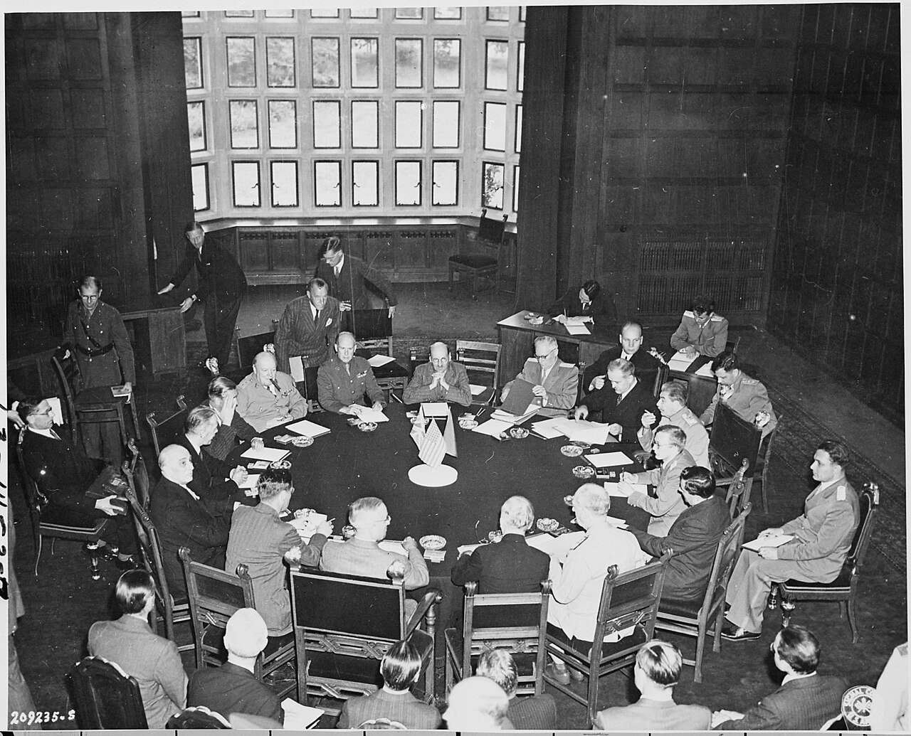 President Harry S. Truman, British Prime Minister Winston Churchill, and Soviet Union Prime Minister Josef Stalin and…
