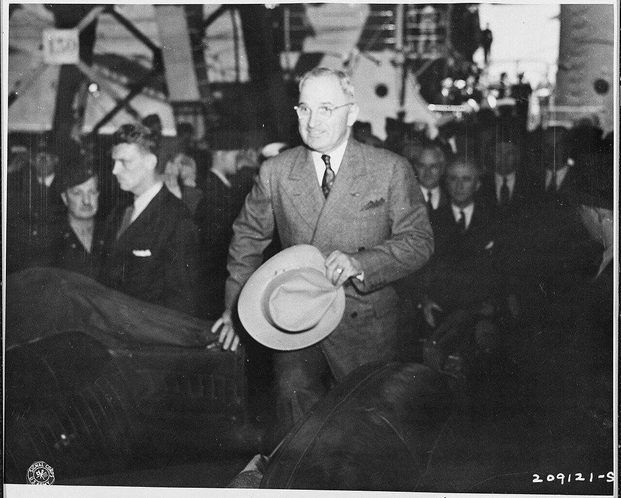President Harry S. Truman steps into an automobile in Antwerp, Belgium where he has just arrived en route to the…