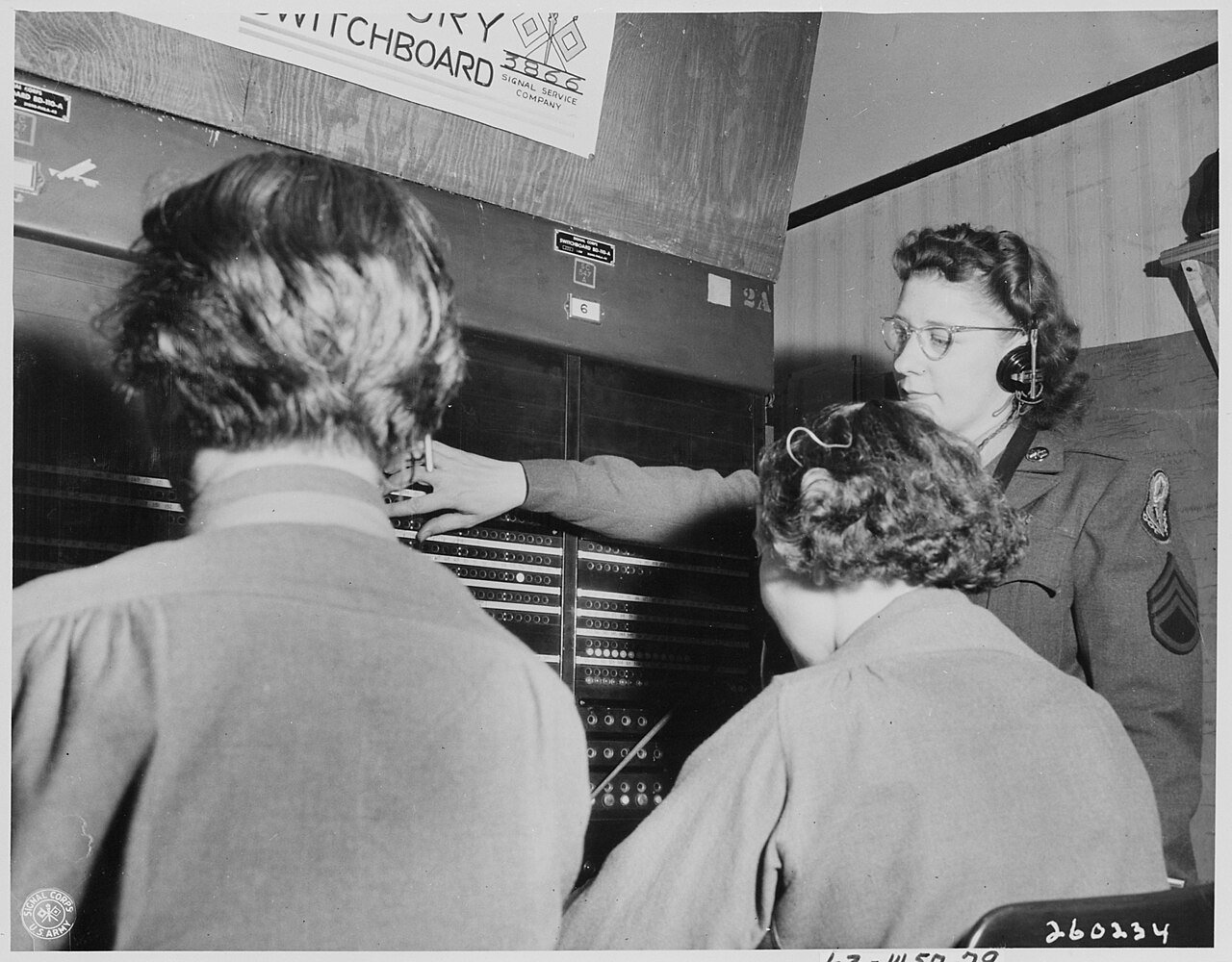 S. Sgt. Lorraine Robitaille, switchboard supervisor, from Duluth, Minnesota, looks down the line of the Victory…