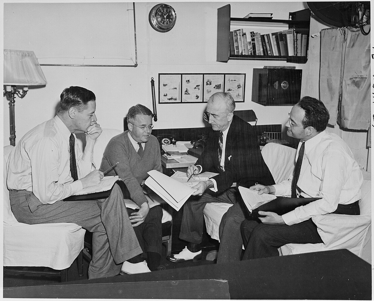 Secretary of State James Byrnes consults with advisors in preparation for the Potsdam Conference in Germany. L to R…