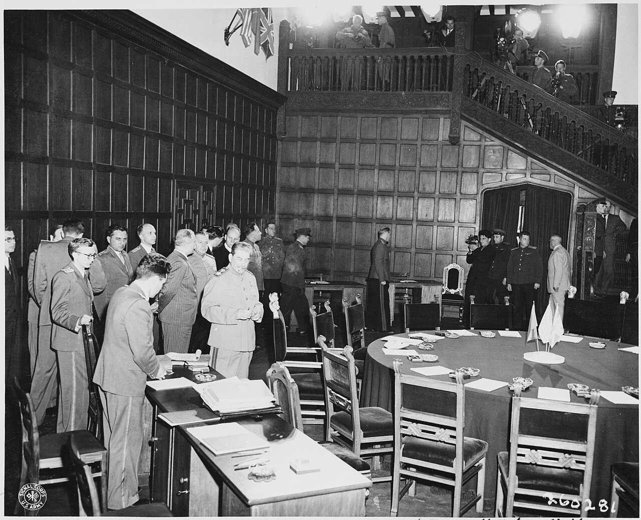 Soviet leader Josef Stalin and Soviet foreign minister Vyacheslav Molotov (behind Stalin) standing near the…