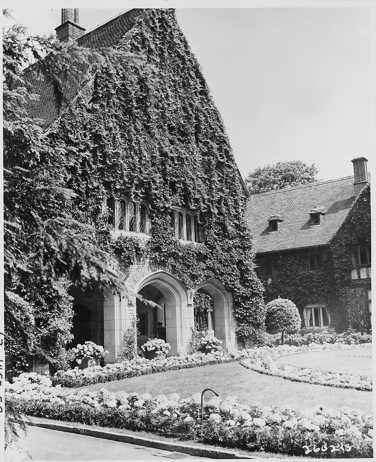 The main entrance of Cecilienhof Palace, site of the Potsdam Conference in Potsdam, Germany, looks out on a vista of…