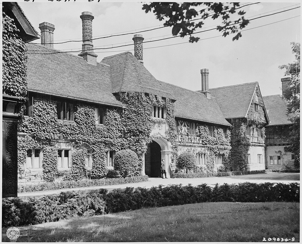 The Schlosse Cecilienhof, Potsdam, Germany, site of the Potsdam Conference. Russian officers are on guard at the…