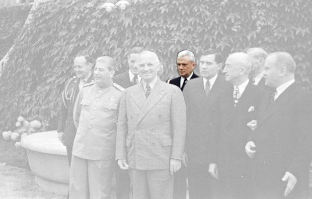 Harry S. Truman and Joseph Stalin meeting at the Potsdam Conference on 18 July 1945. From left to right, first row: Stalin , Truman , Soviet Ambassador Gromyko , US Secretary of State Byrnes , and Soviet Foreign Minister Molotov . Second row: Truman confidant Vaughan [1] , Russian interpreter Bohlen , Truman naval aide Vardaman , and Ross (partially obscured).