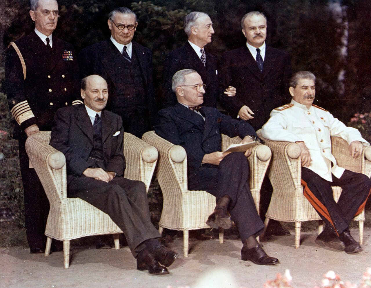 USA C-1860 (Color): Potsdam Conference, July-August 1945. The Big Three pose with their principal advisors, at Potsdam, Germany, circa 28 July 1 August 1945. The three heads of government are (seated, left to right): British Prime Minister Clement Atlee; U.S. President Harry S. Truman; Soviet Premier Joseph Stalin. Standing behind them are (left ot right): Fleet Admiral William D. Leahy, USN, Truman's Chief of Staff; British Foreign Minister Ernest Bevin; U.S. Secretary of State James F. Byrnes; Soviet Foreign Minister Vyacheslav Molotov. Photograph from the Army Signal Corps Collection in the U.S. National Archives. (2016/04/06).