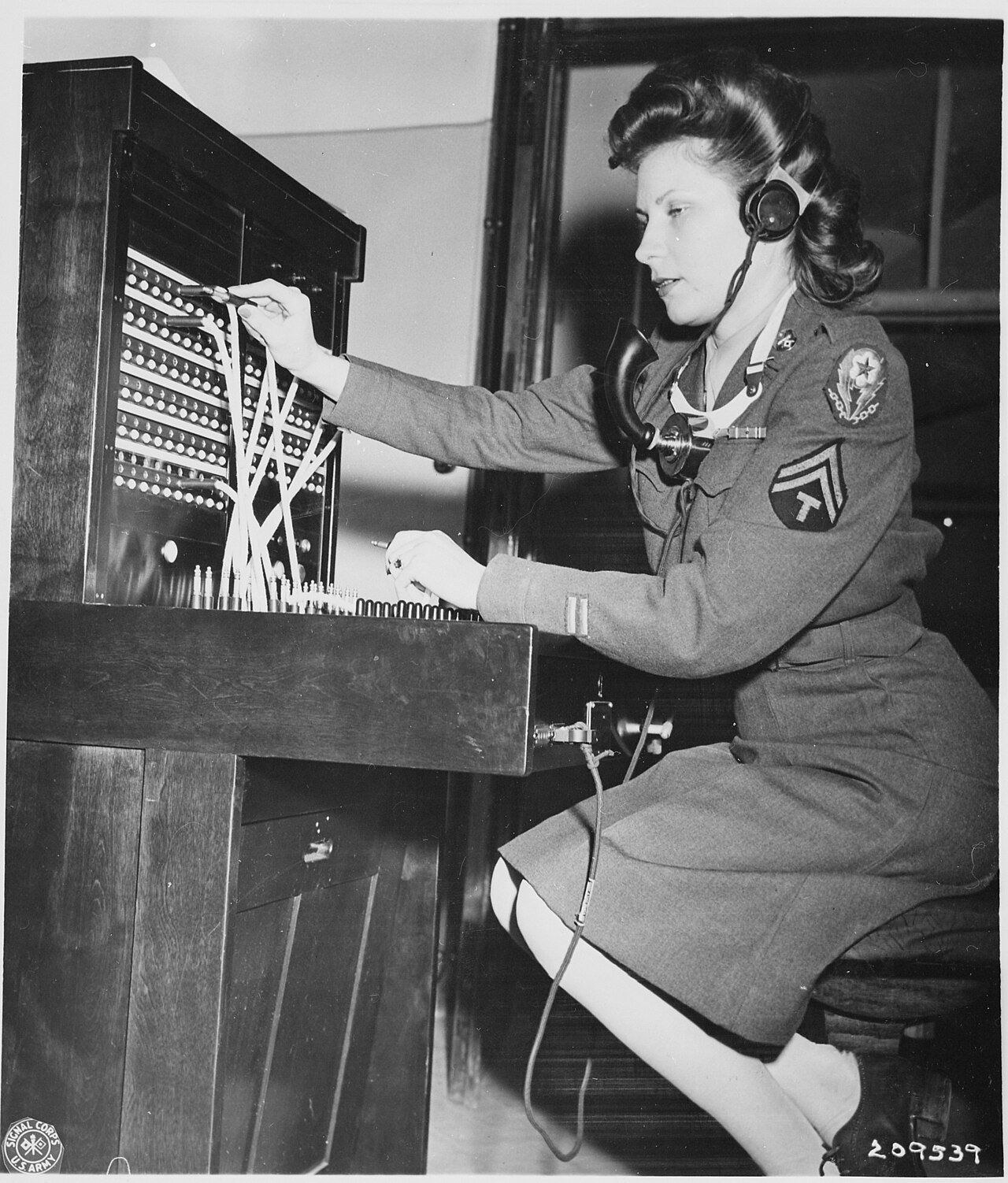 WAC Cpl. Alma Bradley operates the switchboard at the "Little White House," the residence of President Harry S.…