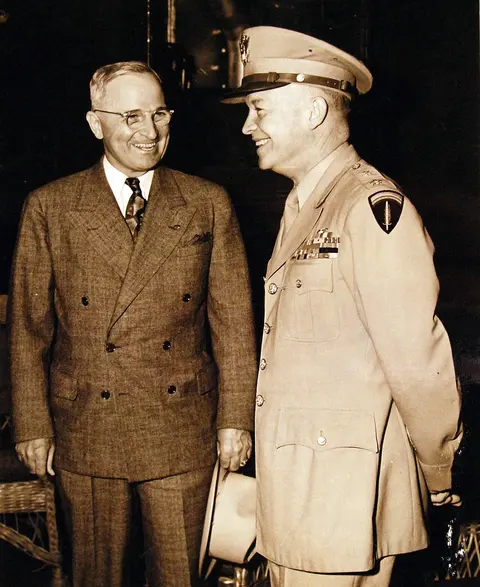 80-G-49922: Potsdam Conference, 17 July – 2 August 1945. President Harry S. Truman being greeted by General Dwight D. Eisenhower onboard USS Augusta (CA 31) as he arrived in Antwerp. Photograph received July 18, 1945. U.S. Navy Photograph, now in the collections of the National Archives. (2016/02/23).