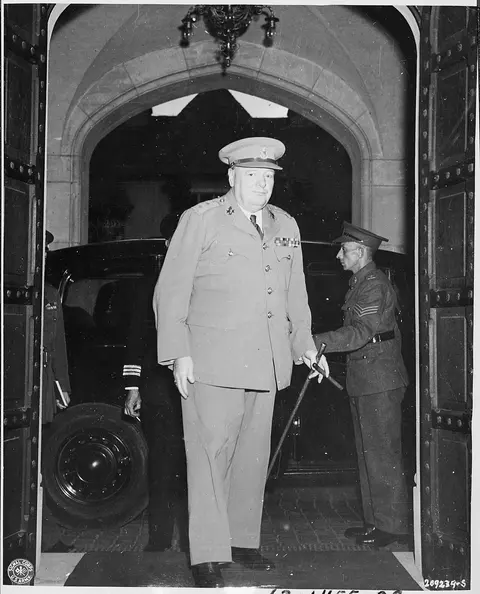 British Prime Minister Winston Churchill arrives at Cecilienhof Palace in Potsdam, Germany for the opening of the…