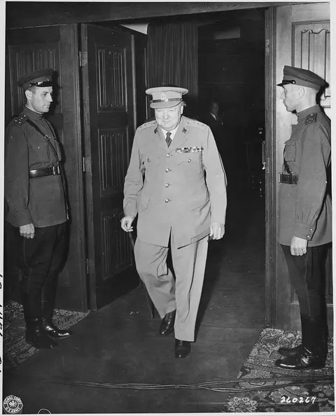 British Prime Minister Winston Churchill leaving the conference room during the Potsdam Conference in Potsdam…